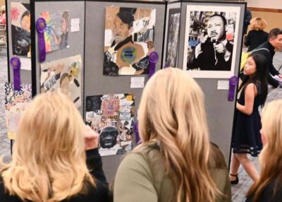 People looking at event exhibits